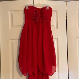 red strapless corset dress with train purchased from Hope’s